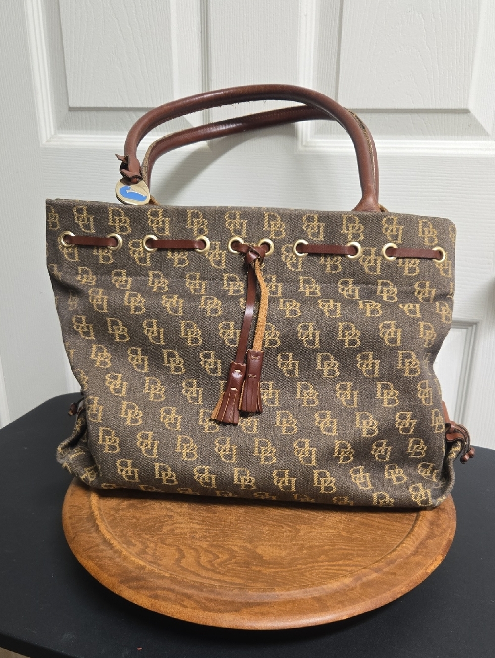 Dooney & Bourke Brown Logo-Print Drawstring Tote with Tassel